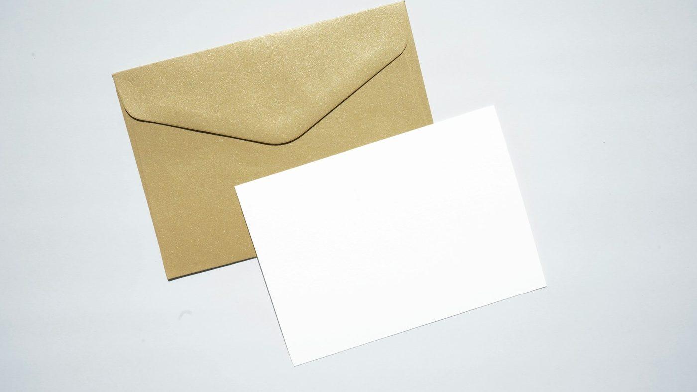 An envelope with a blank letter on a light surface